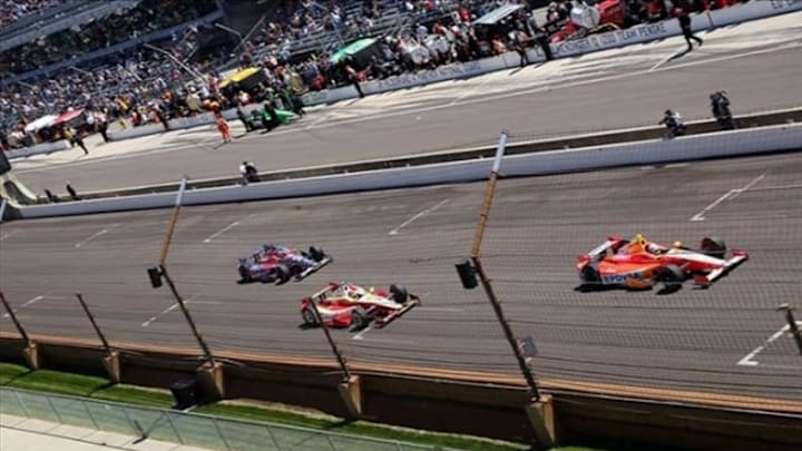 May 24, 2013; Indianapolis, IN, USA; IndyCar Series driver E.J. Viso leads Helio Castroneves and Marco Andretti down the front straight away during carb day for the 2013 Indianapolis 500 at Indianapolis Motor Speedway. Mandatory Credit: Brian Spurlock-USA TODAY Sports