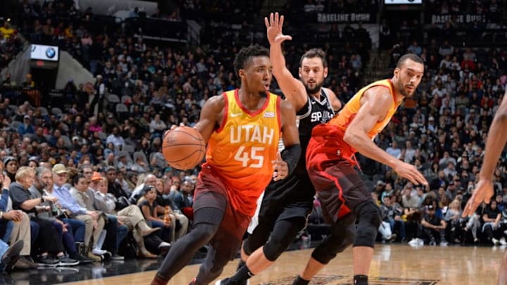 SAN ANTONIO, TX - DECEMBER 9: Donovan Mitchell #45 of the Utah Jazz drives to the basket against the San Antonio Spurs on December 9, 2018 at the AT&T Center in San Antonio, Texas. NOTE TO USER: User expressly acknowledges and agrees that, by downloading and or using this photograph, user is consenting to the terms and conditions of the Getty Images License Agreement. Mandatory Copyright Notice: Copyright 2018 NBAE (Photos by Mark Sobhani/NBAE via Getty Images)