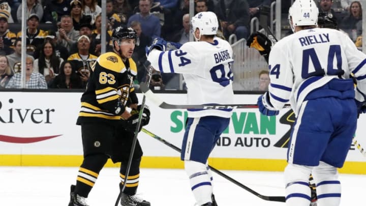 BOSTON, MA - OCTOBER 22: Boston Bruins left wing Brad Marchand (63) and Toronto Maple Leafs defenseman Tyson Barrie (94) mix it up during a game between the Boston Bruins and the Toronto Maple Leafs on October 22, 2019, at TD Garden in Boston, Massachusetts. (Photo by Fred Kfoury III/Icon Sportswire via Getty Images)