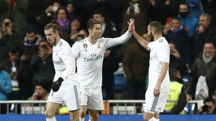 MADRID, SPAIN – FEBRUARY 10: Gareth Bale (L), Cristiano Ronaldo (C) and Karim Benzema of Real Madrid celebrate afer scoring during the La Liga match between Real Madrid and Real Sociedad at Estadio Santiago Bernabeu on February 10, 2018 in Madrid, Spain. (Photo by Helios de la Rubia/Real Madrid via Getty Images)