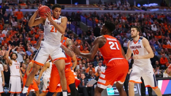 Mar 27, 2016; Chicago, IL, USA; Virginia Cavaliers forward Isaiah Wilkins (21) rebounds the ball as Syracuse Orange forward Tyler Roberson (21) looks on during the second half in the championship game of the midwest regional of the NCAA Tournament at the United Center. Mandatory Credit: Dennis Wierzbicki-USA TODAY Sports