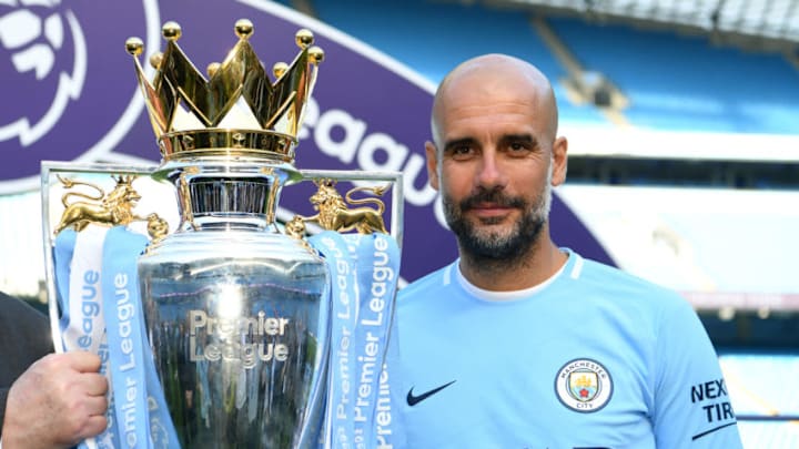 MANCHESTER, ENGLAND - MAY 06: Josep Guardiola, Manager of Manchester City poses with The Premier League Trophy after the Premier League match between Manchester City and Huddersfield Town at Etihad Stadium on May 6, 2018 in Manchester, England. (Photo by Michael Regan/Getty Images)