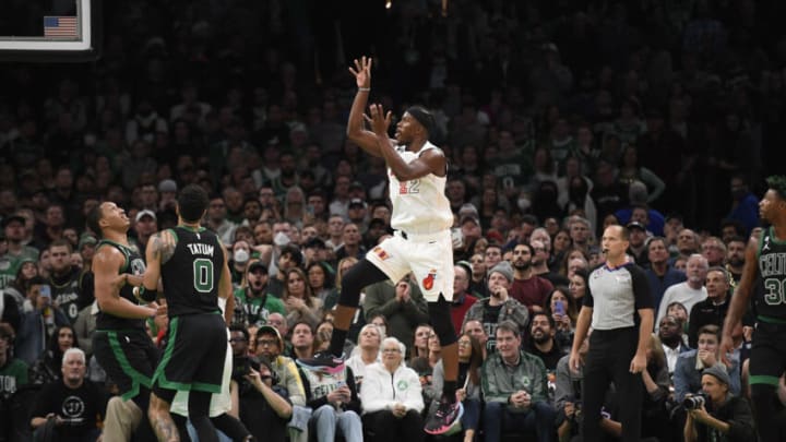 Miami Heat forward Jimmy Butler (22) shoots the ball while Boston Celtics forward Grant Williams (12) and forward Jayson Tatum (0) look on(Bob DeChiara-USA TODAY Sports)