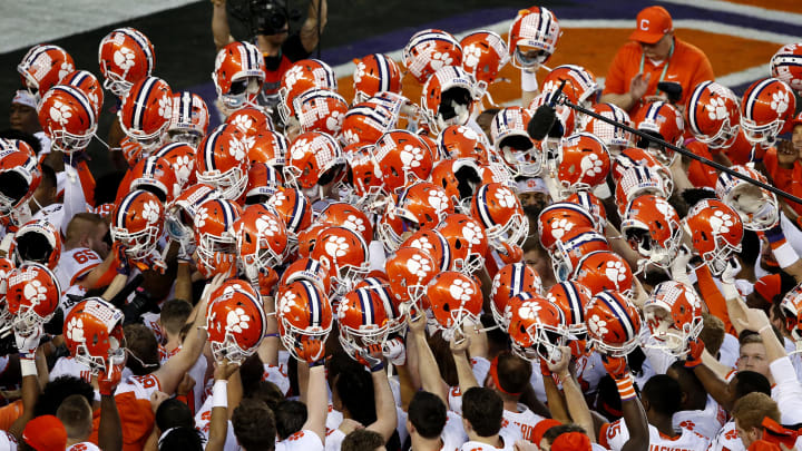 SANTA CLARA, CALIFORNIA – JANUARY 07: The Clemson Tigers hold up their helmets in the end zone prior to the College Football Playoff National Championship against the Alabama Crimson Tide at Levi’s Stadium on January 07, 2019 in Santa Clara, California. (Photo by Lachlan Cunningham/Getty Images)