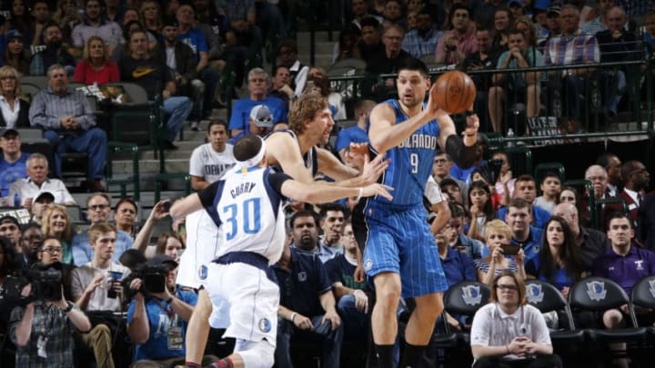 DALLAS, TX - FEBRUARY 11: Nikola Vucevic #9 of the Orlando Magic looks to pass against the Dallas Mavericks on February 11, 2017 at the American Airlines Center in Dallas, Texas. NOTE TO USER: User expressly acknowledges and agrees that, by downloading and or using this photograph, User is consenting to the terms and conditions of the Getty Images License Agreement. Mandatory Copyright Notice: Copyright 2017 NBAE (Photo by Glenn James/NBAE via Getty Images)