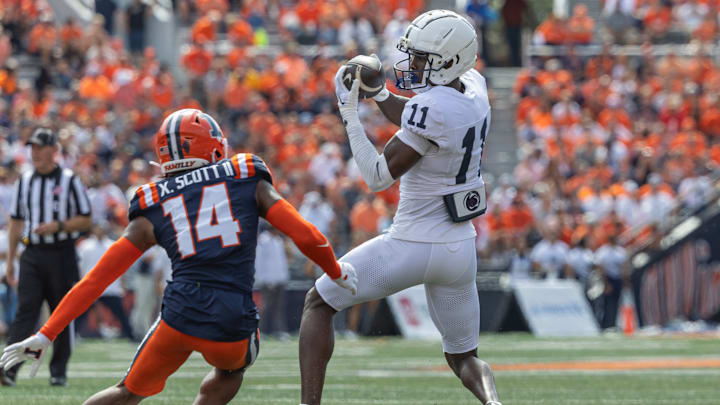 CHAMPAIGN, ILLINOIS – SEPTEMBER 16: Malik McClain #11 of the Penn State Nittany Lions catches the ball against Xavier Scott #14 of the Illinois Fighting Illini during the first half at Memorial Stadium on September 16, 2023 in Champaign, Illinois. (Photo by Michael Hickey/Getty Images)