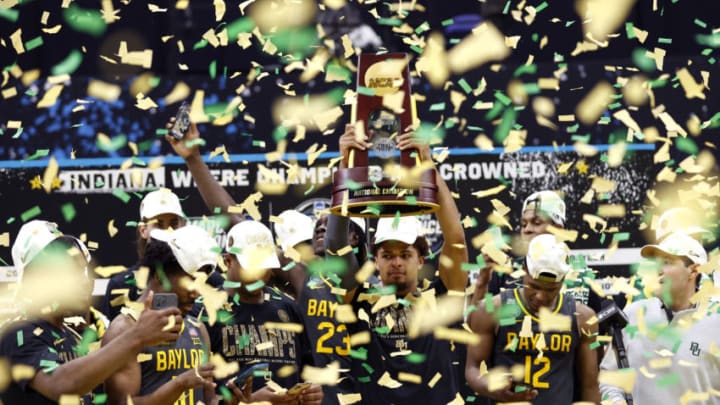 INDIANAPOLIS, INDIANA - APRIL 05: MaCio Teague #31 of the Baylor Bears holds up the trophy after defeating the Gonzaga Bulldogs 86-70 in the National Championship game of the 2021 NCAA Men's Basketball Tournament at Lucas Oil Stadium on April 05, 2021 in Indianapolis, Indiana. (Photo by Jamie Squire/Getty Images)