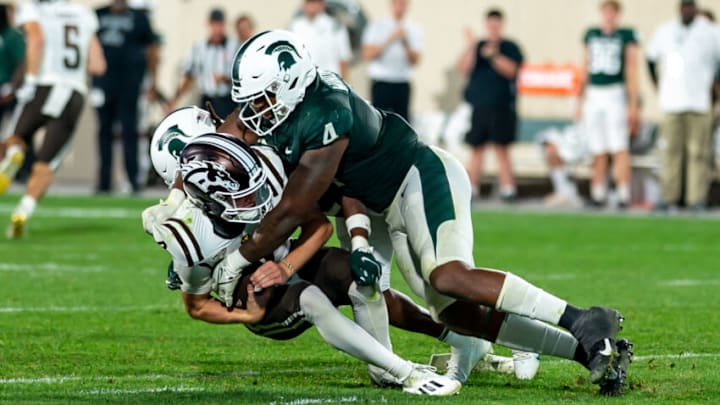 EAST LANSING, MI - SEPTEMBER 02: Jacoby Windmon #3 of the Michigan State Spartans sacks quarterback Jack Salopek #6 of the Western Michigan Broncos in the second half at Spartan Stadium on September 2, 2022 in East Lansing, Michigan. (Photo by Jaime Crawford/Getty Images)