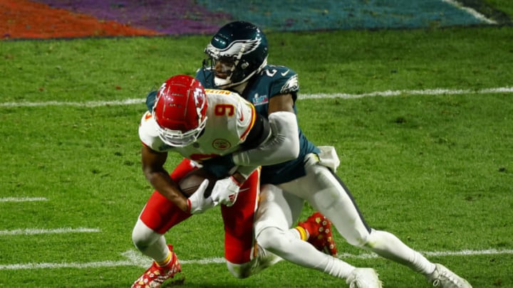 GLENDALE, AZ - FEBRUARY 12: James Bradberry #24 of the Philadelphia Eagles tackles JuJu Smith-Schuster #9 of the Kansas City Chiefs during the fourth quarter in Super Bowl LVII at State Farm Stadium on February 12, 2023 in Glendale, Arizona. (Photo by Kevin Sabitus/Getty Images)