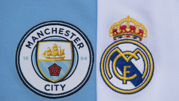 The Manchester City and Real Madrid club crests (Photo by Visionhaus)