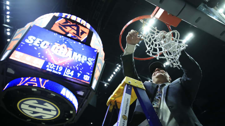 NASHVILLE, TENNESSEE – MARCH 17: Bruce Pearl of the Auburn Tigers gives cuts the net after 84-64 win over the Tennessee Volunteers during the final of the SEC Basketball Championships at Bridgestone Arena on March 17, 2019 in Nashville, Tennessee. (Photo by Andy Lyons/Getty Images)