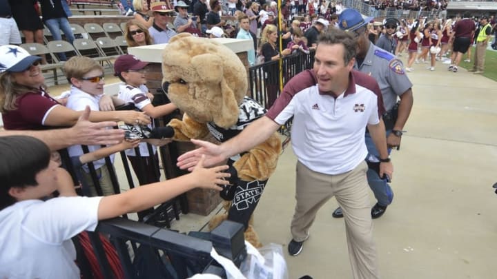 Nov 5, 2016; Starkville, MS, USA; Mississippi State Bulldogs head coach Dan Mullen celebrates with fans after the game against the Texas A&M Aggies at Davis Wade Stadium. Mississippi State won 35-28. Mandatory Credit: Matt Bush-USA TODAY Sports