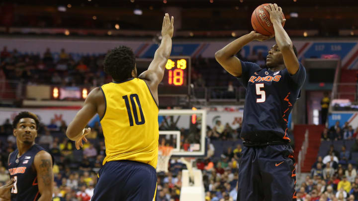 Mar 9, 2017; Washington, DC, USA; Illinois Fighting Illini guard Jalen Coleman-Lands (5) shoots the ball over Michigan Wolverines guard Derrick Walton Jr. (10) in the first half during the Big Ten Conference Tournament at Verizon Center. Mandatory Credit: Geoff Burke-USA TODAY Sports