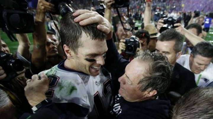New England Patriots head coach Bill Belichick (right) celebrates with quarterback Tom Brady (12) after defeating the Seattle Seahawks in Super Bowl XLIX at University of Phoenix Stadium. Mandatory Credit: Mark J. Rebilas-USA TODAY Sports