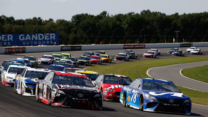 LONG POND, PA - JULY 29: Erik Jones, driver of the #20 Reser's Toyota, and Martin Truex Jr., driver of the #78 Auto-Owners Insurance Toyota, lead the field during the Monster Energy NASCAR Cup Series Gander Outdoors 400 at Pocono Raceway on July 29, 2018 in Long Pond, Pennsylvania. (Photo by Chris Trotman/Getty Images)
