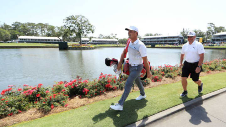 PONTE VEDRA BEACH, FL – MAY 09: Bryson DeChambeau of the United States carries his bag during practice rounds prior to THE PLAYERS Championship on the Stadium Course at TPC Sawgrass on May 9, 2018 in Ponte Vedra Beach, Florida. (Photo by Mike Ehrmann/Getty Images)