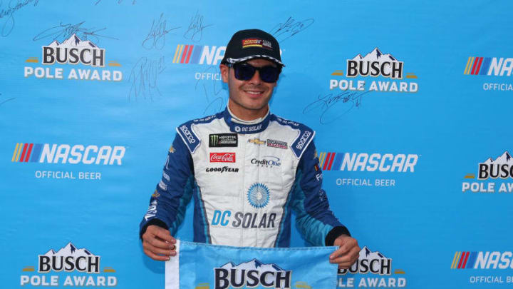 BRISTOL, TN - AUGUST 17: Kyle Larson, driver of the #42 DC Solar Chevrolet, poses with the pole award after qualifying for the Monster Energy NASCAR Cup Series Bass Pro Shops NRA Night Race at Bristol Motor Speedway on August 17, 2018 in Bristol, Tennessee. (Photo by Sarah Crabill/Getty Images)