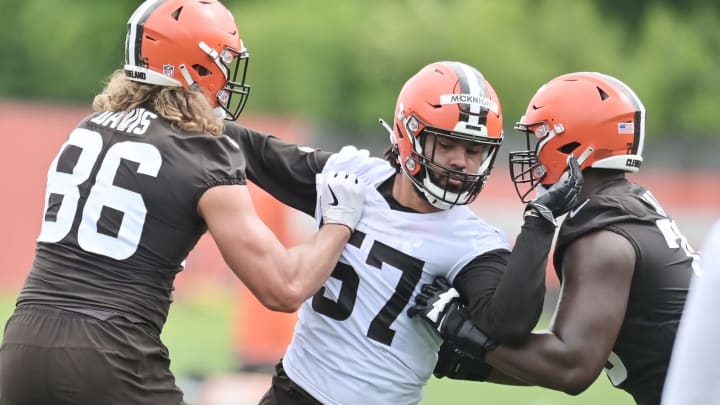 Jun 9, 2021; Berea, Ohio, USA; Cleveland Browns tight end Connor Davis (86) and offensive tackle Greg Senat (70) block defensive end Romeo McKnight (57) during organized team activities at the Cleveland Browns training facility. Mandatory Credit: Ken Blaze-USA TODAY Sports