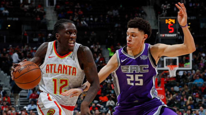 ATLANTA, GA - NOVEMBER 15: Taurean Prince #12 of the Atlanta Hawks drives against Justin Jackson #25 of the Sacramento Kings at Philips Arena on November 15, 2017 in Atlanta, Georgia. NOTE TO USER: User expressly acknowledges and agrees that, by downloading and or using this photograph, User is consenting to the terms and conditions of the Getty Images License Agreement. (Photo by Kevin C. Cox/Getty Images)