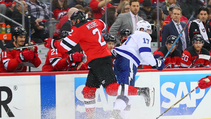 NEWARK, NJ – APRIL 18: Tampa Bay Lightning left wing Alex Killorn (17) collides with New Jersey Devils defenseman John Moore (2) during the third period of the First Round Stanley Cup Playoff Game 4 between the New Jersey Devils and the Tampa Bay Lightning on April 18, 2018, at the Prudential Center in Newark, NJ. (Photo by Rich Graessle/Icon Sportswire via Getty Images)