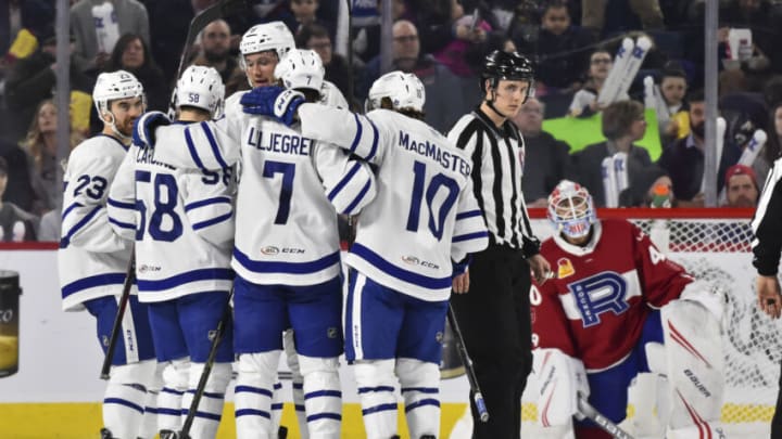 LAVAL, QC - MARCH 08: Michael Carcone #58 of the Toronto Marlies celebrates a second period goal with teammates against the Laval Rocket during the AHL game at Place Bell on March 8, 2019 in Laval, Quebec, Canada. (Photo by Minas Panagiotakis/Getty Images)