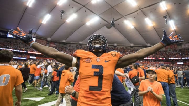 SYRACUSE, NY - OCTOBER 13: Ervin Philips #3 of the Syracuse Orange celebrates the upset win over Clemson Tigers after fans storm the field at the Carrier Dome on October 13, 2017 in Syracuse, New York. Syracuse defeats Clemson 27-24. (Photo by Brett Carlsen/Getty Images)