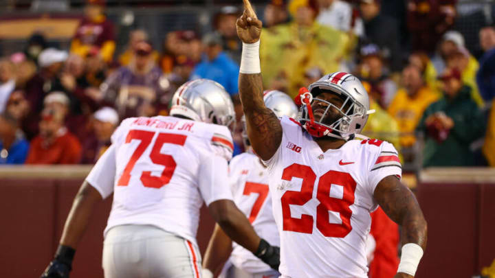 Sep 2, 2021; Minneapolis, Minnesota, USA; Ohio State Buckeyes running back Miyan Williams (28) reacts after scoring a touchdown during the first quarter against the Minnesota Gophers at Huntington Bank Stadium. Mandatory Credit: Harrison Barden-USA TODAY Sports