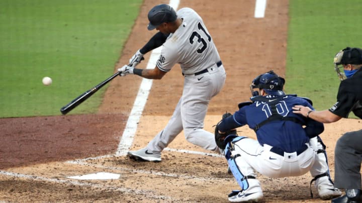 SAN DIEGO, CALIFORNIA - OCTOBER 09: Aaron Hicks #31 of the New York Yankees hits a single against the Tampa Bay Rays during the sixth inning in Game Five of the American League Division Series at PETCO Park on October 09, 2020 in San Diego, California. (Photo by Christian Petersen/Getty Images)
