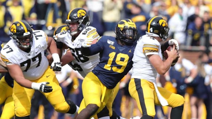 Michigan defensive lineman Kwity Paye sacks the Iowa quarterback Nate Stanley during the first half on Saturday, Oct. 5, 2019, at Michigan Stadium.Michigan Football