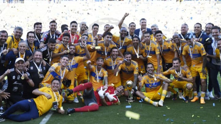 Tigres players pose with the Liga MX Champions Cup trophy after defeating Pachuca 2-1 on Sunday. (Photo by Kevork Djansezian/Getty Images)