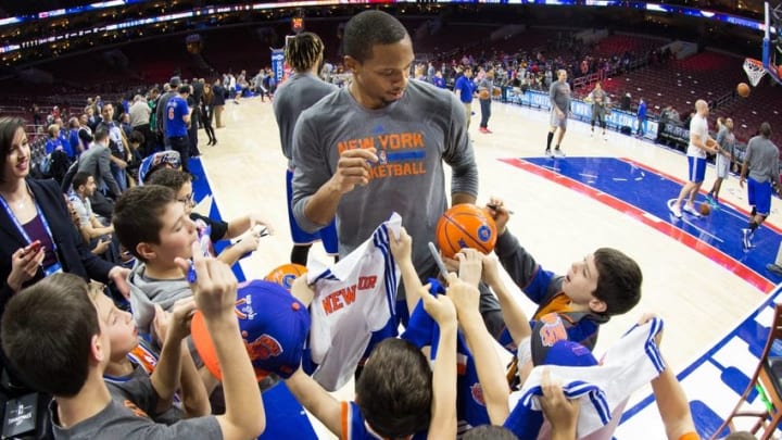 Dec 18, 2015; Philadelphia, PA, USA; New York Knicks forward Lance Thomas (42) signs autographs for young fans prior to a game against the Philadelphia 76ers at Wells Fargo Center. Mandatory Credit: Bill Streicher-USA TODAY Sports
