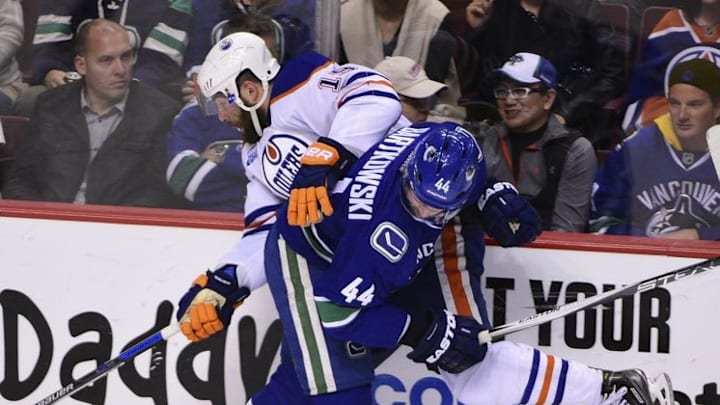 Apr 9, 2016; Vancouver, British Columbia, CAN; Vancouver Canucks defenseman Matt Bartkowski (44) checks Edmonton Oilers forward Patrick Maroon (19) during the second period at Rogers Arena. Mandatory Credit: Anne-Marie Sorvin-USA TODAY Sports