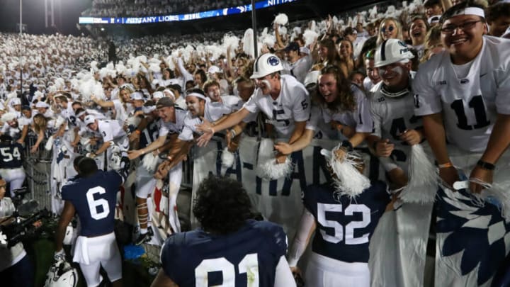 Penn State Nittany Lion players celebrate with members of the Penn State student section following the competition of the game against the Auburn Tigers at Beaver Stadium. Penn State defeated Auburn 28-20. Mandatory Credit: Matthew OHaren-USA TODAY Sports