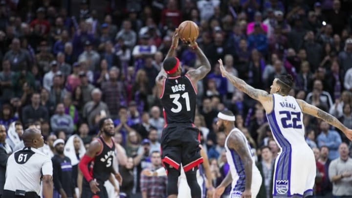 Nov 20, 2016; Sacramento, CA, USA; Toronto Raptors forward Terrence Ross (31) shoots the basketball seemingly tying the basketball game against Sacramento Kings forward Matt Barnes (22), but the shot is ruled after time had expired during the fourth quarter at Golden 1 Center. The Kings won 102-99. Mandatory Credit: Neville E. Guard-USA TODAY Sports