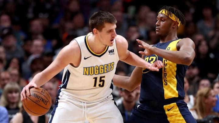 DENVER, CO - APRIL 03: Nikola Jokic #15 of the Denver Nuggets works towards the basket against Myles Turner #33 of th Indiana Pacers at the Pepsi Center on April 3, 2018 in Denver, Colorado. NOTE TO USER: User expressly acknowledges and agrees that, by downloading and or using this photograph, User is consenting to the terms and conditions of the Getty Images License Agreement. (Photo by Matthew Stockman/Getty Images)