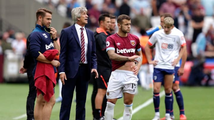 LONDON, ENGLAND - AUGUST 18: Manuel Pellegrini, Manager of West Ham United talks with Jack Wilshere of West Ham United during the Premier League match between West Ham United and AFC Bournemouth at London Stadium on August 18, 2018 in London, United Kingdom. (Photo by Henry Browne/Getty Images)