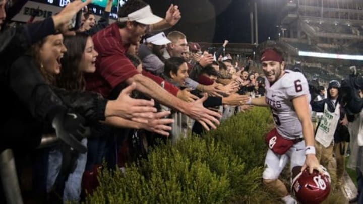 Nov 14, 2015; Waco, TX, USA; Oklahoma Sooners quarterback Baker Mayfield (6) celebrates with the Sooner fans after the win over the Baylor Bears at McLane Stadium. The Sooners defeat the Bears 44-34. Mandatory Credit: Jerome Miron-USA TODAY Sports