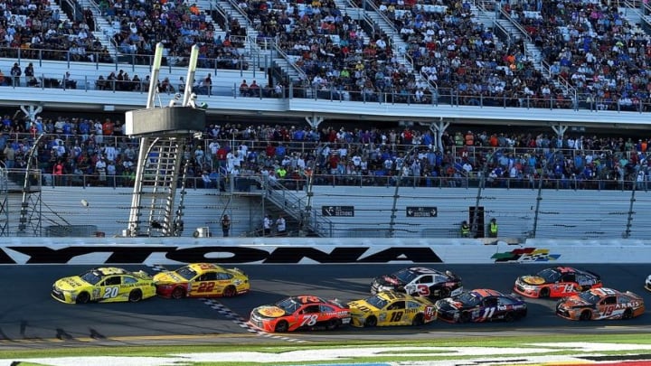 Feb 21, 2016; Daytona Beach, FL, USA; NASCAR Sprint Cup Series driver Matt Kenseth (20) and Joey Logano (22) restart ahead of NASCAR Sprint Cup Series driver Martin Truex Jr. (78) and Kyle Busch (18) during the Daytona 500 at Daytona International Speedway. Mandatory Credit: Jasen Vinlove-USA TODAY Sports