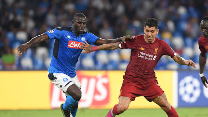 NAPLES, ITALY - SEPTEMBER 17: Kalidou Koulibaly of SSC Napoli vies with Roberto Firmino of Liverpool FC during the UEFA Champions League group E match between SSC Napoli and Liverpool FC at Stadio San Paolo on September 17, 2019 in Naples, Italy. (Photo by Francesco Pecoraro/Getty Images)
