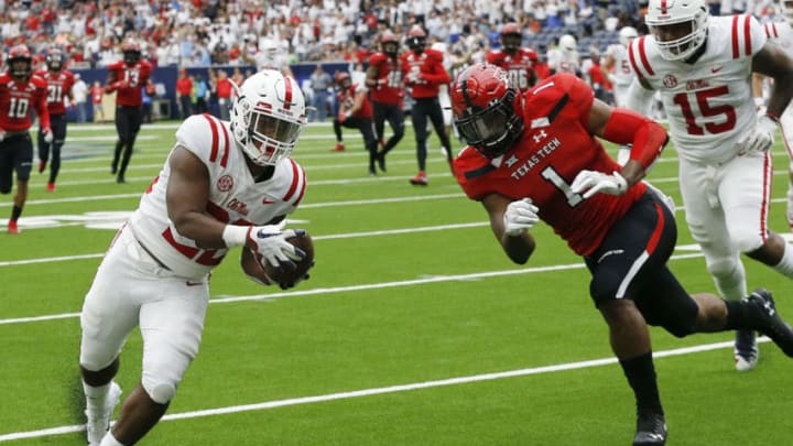 HOUSTON, TX - SEPTEMBER 01: Scottie Phillips #22 of the Mississippi Rebels scores in the second quarter as Jordyn Brooks #1 of the Texas Tech Red Raiders attempts to keep him out ot the endzone at NRG Stadium on September 1, 2018 in Houston, Texas. (Photo by Bob Levey/Getty Images)