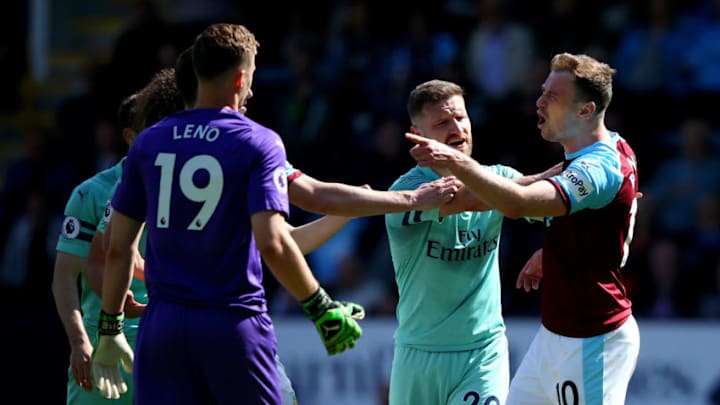 BURNLEY, ENGLAND - MAY 12: Shkodran Mustafi steps in as teammate Stephan Lichtsteiner of Arsenal clashes with Ashley Barnes of Burnley during the Premier League match between Burnley FC and Arsenal FC at Turf Moor on May 12, 2019 in Burnley, United Kingdom. (Photo by Alex Livesey/Getty Images)