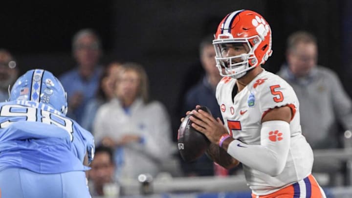 Clemson quarterback DJ Uiagalelei (5) fades back to pass near North Carolina defensive lineman Kevin Hester (98) during the first quarter of the ACC Championship football game at Bank of America Stadium in Charlotte, North Carolina Saturday, Dec 3, 2022.Clemson Tigers Football Vs North Carolina Tar Heels Acc Championship Charlotte Nc
