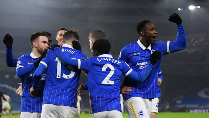 BRIGHTON, ENGLAND - DECEMBER 07: Pascal Gross of Brighton & Hove Albion (2L) celebrates after scoring their sides first goal from the penalty spot with Aaron Connolly of Brighton & Hove Albion (L) Tariq Lamptey of Brighton & Hove Albion (2R) and Danny Welbeck of Brighton & Hove Albion (R) during the Premier League match between Brighton & Hove Albion and Southampton at American Express Community Stadium on December 07, 2020 in Brighton, England. A limited number of fans (2000) are welcomed back to stadiums to watch elite football across England. This was following easing of restrictions on spectators in tiers one and two areas only. (Photo by Mike Hewitt/Getty Images)