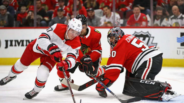 CHICAGO, IL - NOVEMBER 08: Andrei Svechnikov #37 of the Carolina Hurricanes pushes the puck past Corey Crawford #50 of the Chicago Blackhawks to score a first period goal at the United Center on November 8, 2018 in Chicago, Illinois. (Photo by Jonathan Daniel/Getty Images)