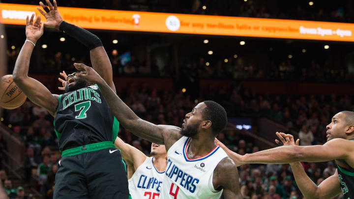 BOSTON, MA – FEBRUARY 9: Jaylen Brown #7 of the Boston Celtics is fouled by JaMychal Green #4 of the Los Angeles Clippers at TD Garden on February 9, 2019 in Boston, Massachusetts. NOTE TO USER: User expressly acknowledges and agrees that, by downloading and or using this photograph, User is consenting to the terms and conditions of the Getty Images License Agreement. (Photo by Kathryn Riley/Getty Images)