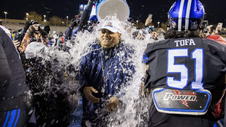 Dec 17, 2022; Albuquerque, New Mexico, USA; Brigham Young Cougars head coach Kalani SitakeÊis given a Gatorade bath after defeating the Southern Methodist Mustangs at University Stadium (Albuquerque). Mandatory Credit: Ivan Pierre Aguirre-USA TODAY Sports