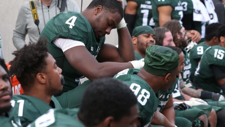 EAST LANSING, MI - OCTOBER 29: Malik McDowell #4 of the Michigan State Spartans sits on the bench late in the fourth quarter during the game against the Michigan Wolverines at Spartan Stadium on October 29, 2016 in East Lansing, Michigan. Michigan defeated Michigan State 32-23. (Photo by Leon Halip/Getty Images)
