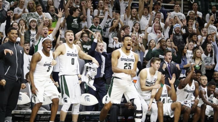 Dec 6, 2016; East Lansing, MI, USA; Michigan State Spartans guard Cassius Winston (5) guard Kyle Ahrens (0) forward Kenny Goins (25) and the rest of the Spartan bench celebrate after a basket during the second half against the Youngstown State Penguins at Jack Breslin Student Events Center. Spartans win 77-57. Mandatory Credit: Raj Mehta-USA TODAY Sports