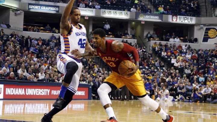 Feb 24, 2016; Indianapolis, IN, USA; Indiana Pacers forward Paul George (13) drives to the basket against New York Knicks forward Lance Thomas (42) at Bankers Life Fieldhouse. Mandatory Credit: Brian Spurlock-USA TODAY Sports