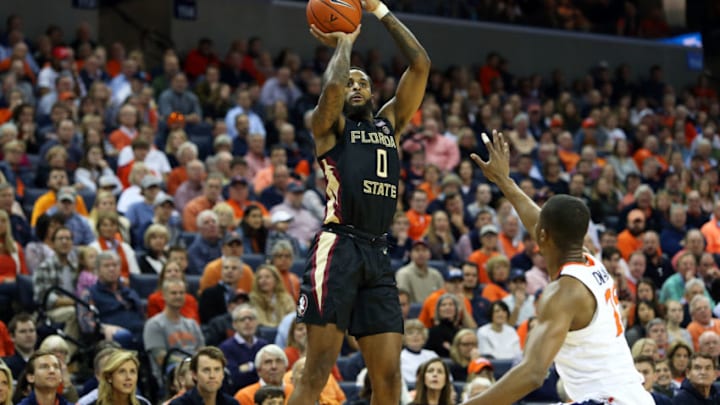 CHARLOTTESVILLE, VA - JANUARY 05: Phil Cofer #0 of the Florida State Seminoles shoots over Mamadi Diakite #25 of the Virginia Cavaliers in the first half during a game at John Paul Jones Arena on January 5, 2019 in Charlottesville, Virginia. (Photo by Ryan M. Kelly/Getty Images)